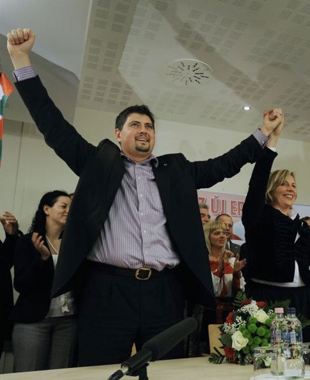 Csanad Szegedi, left, and Krisztina Morvai, right, celebrating their entry into the European Parliament