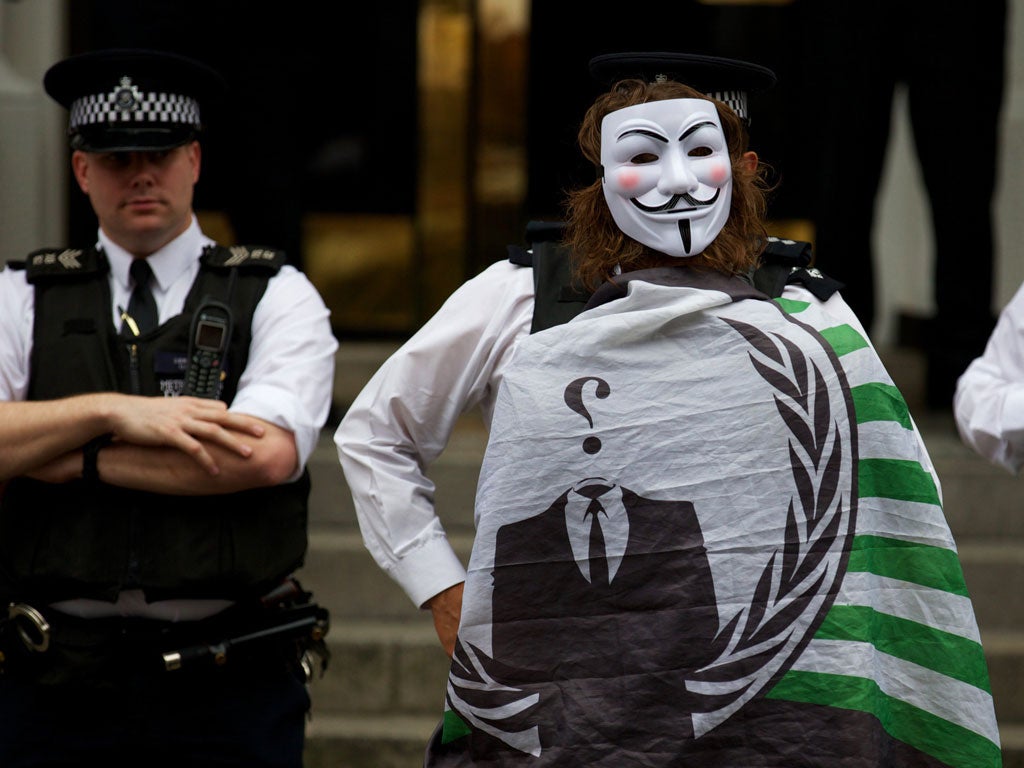 A supporter of WikiLeaks founder Julian Assange protests
outside the Ecuadorean embassy in London