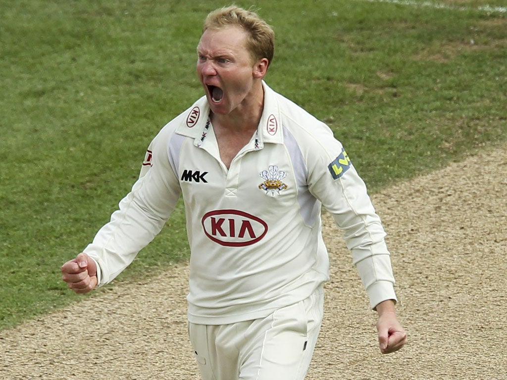 Gareth Batty celebrates taking the wicket of Steven Crook