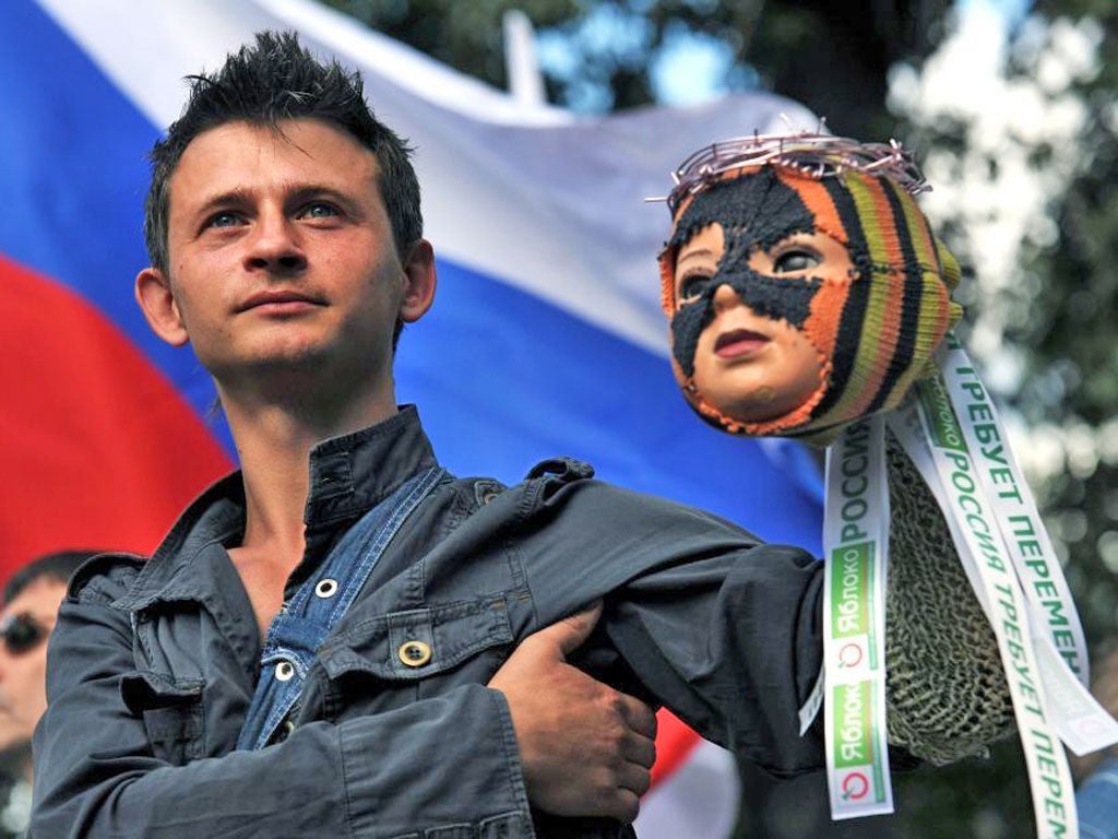 A band supporter with a puppet that is their emblem