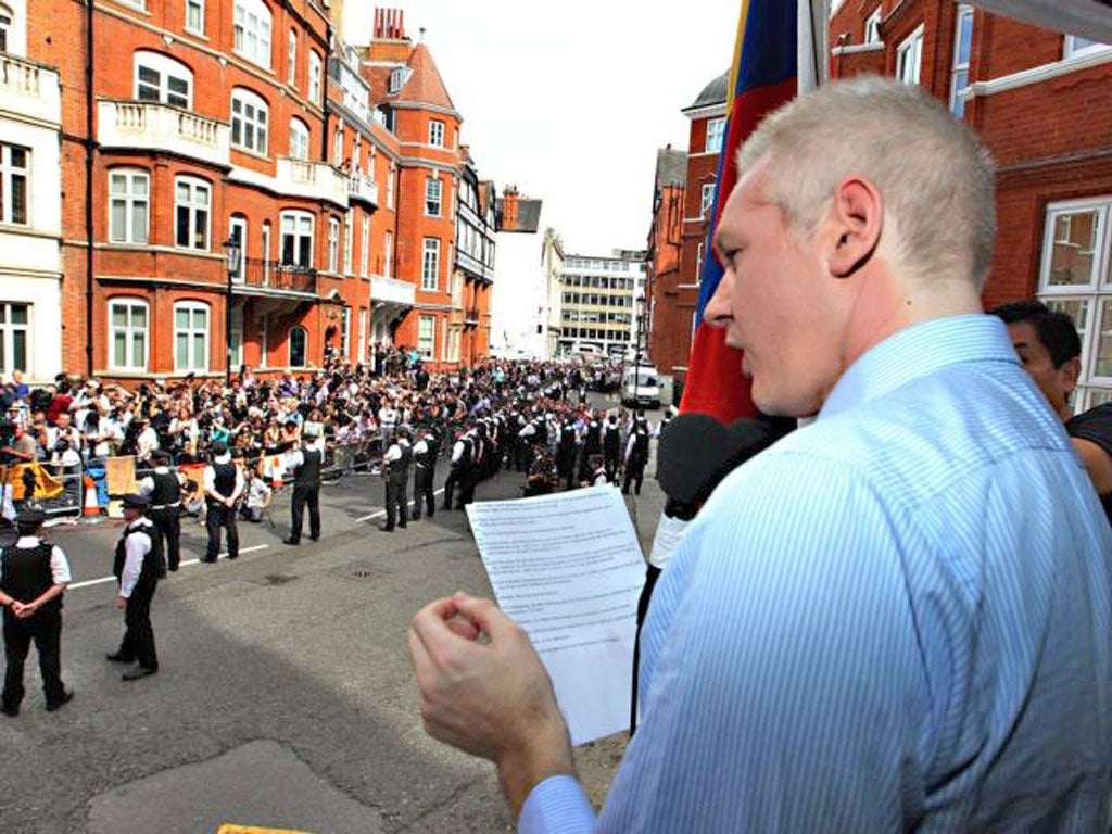 WikiLeaks founder Julian Assange reads his speech from a balcony at the Ecuadorean embassy in central London