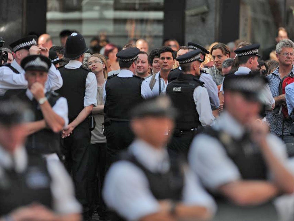 Crowds gather on the pavement to hear Julian Assange’s statement