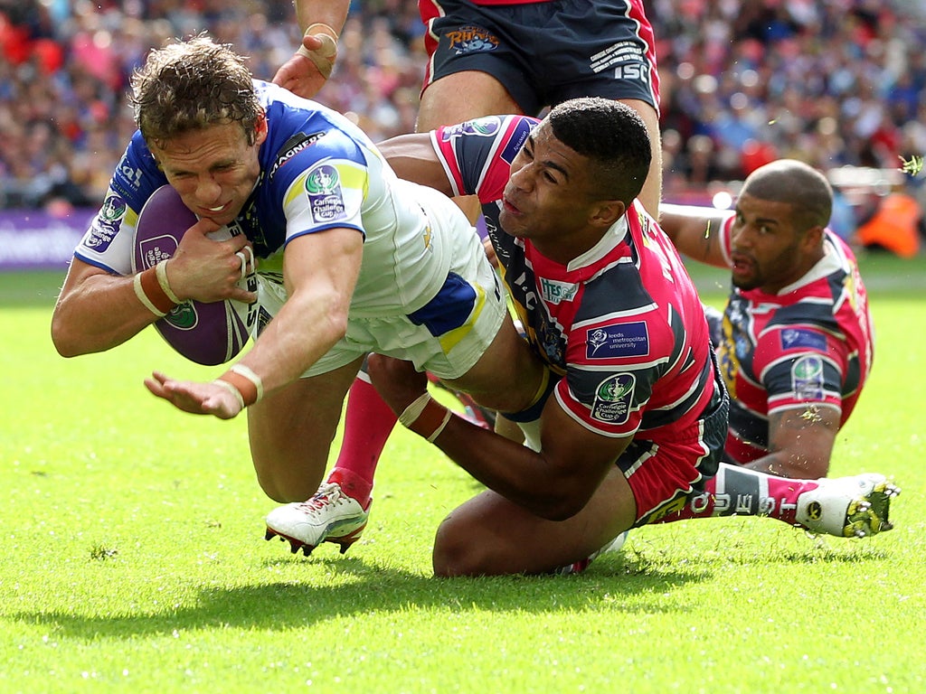 Warrington's Brett Hodgson goes over for his try under pressure from Kallum Watkins