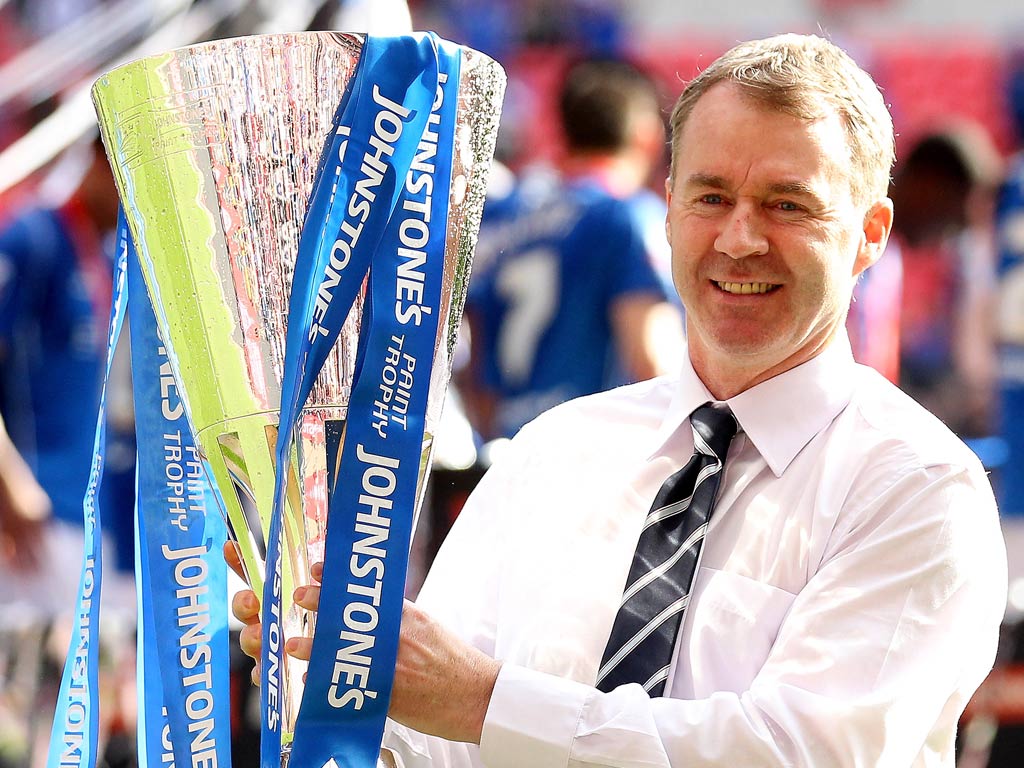 John Sheridan celebrates with the 2012 Johnstone's Paint trophy