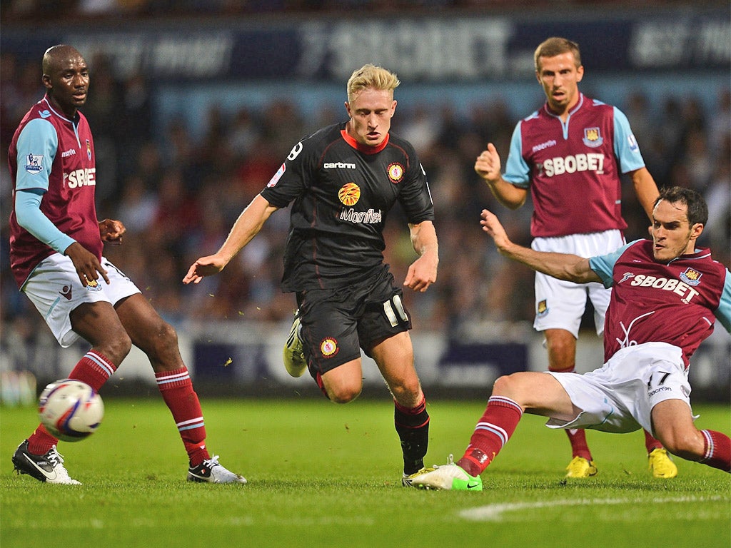 Crewe's Byron Moore is halted by the West Ham defence last night