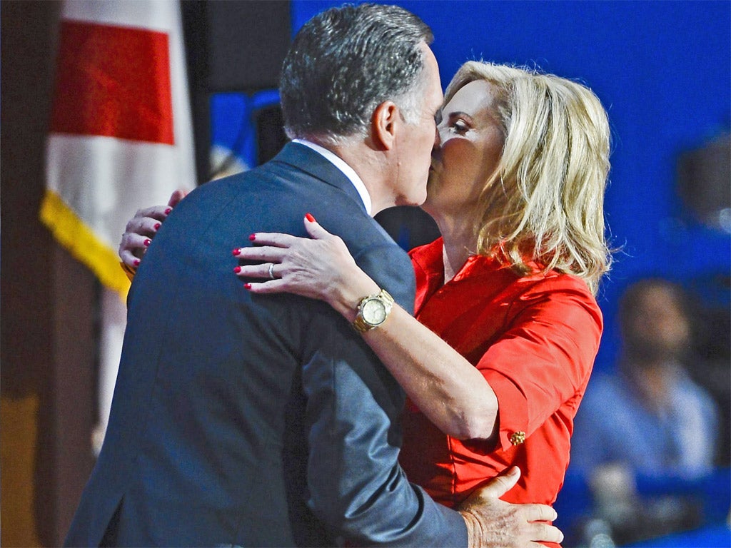 Ann Romney gets a kiss from husband and Republican Presidential Nominee Mitt Romney after her speech