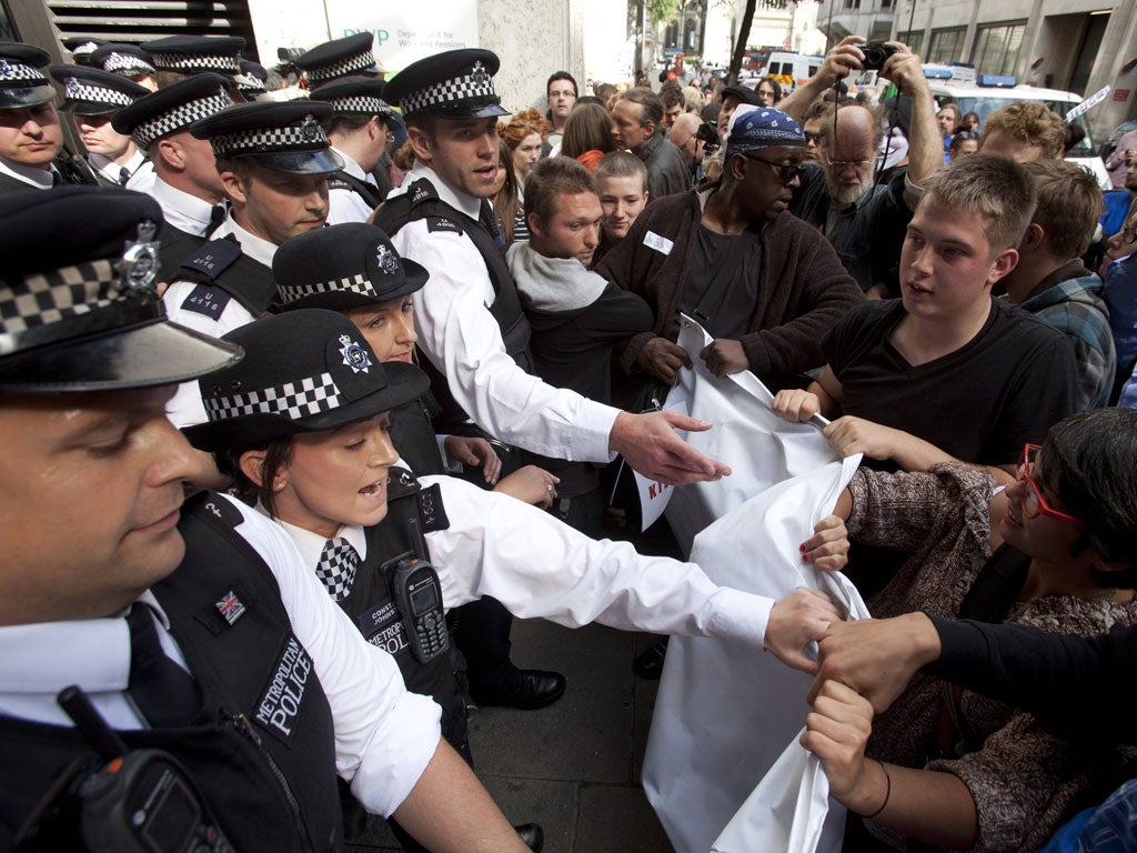 Protesters demonstrate in London yesterday against Atos's role in benefit assessments