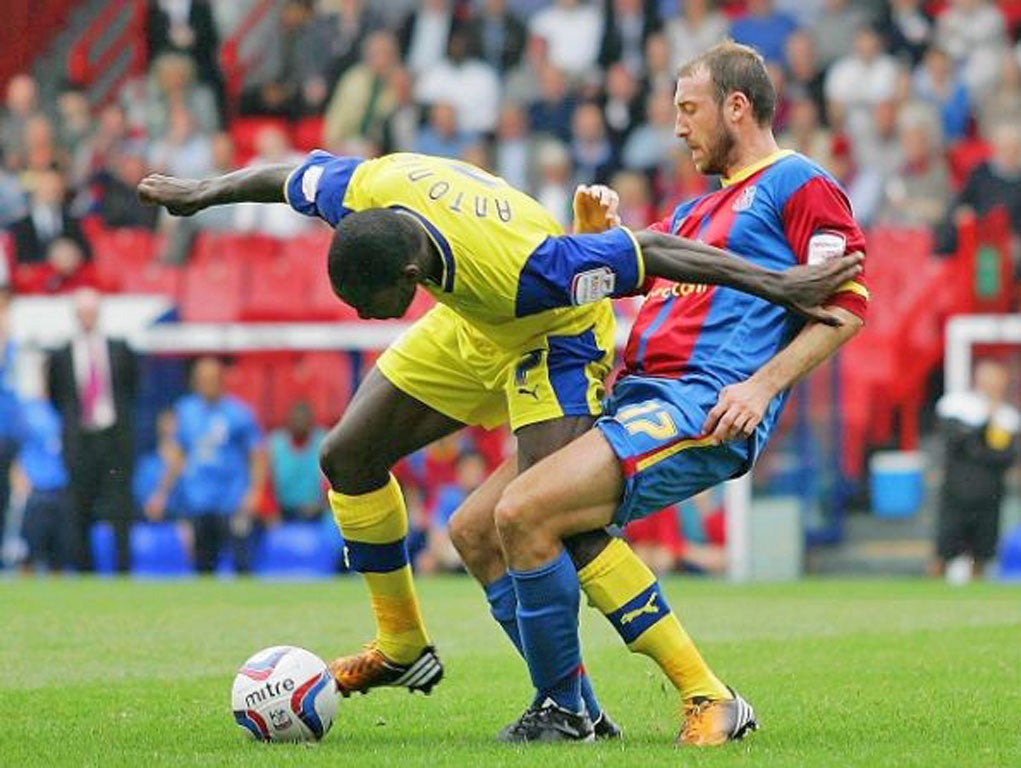 Battle stations: Michail Antonio (left) and Glenn Murray challenge