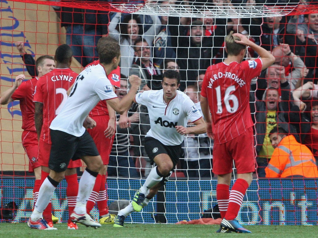 Robin van Persie celebrates his second goal yesterday