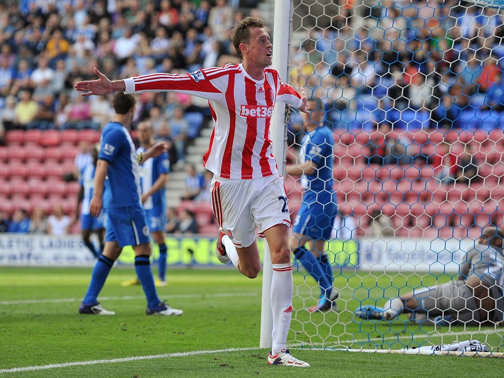 Stoke striker Peter Crouch celebrates a goal against Wigan