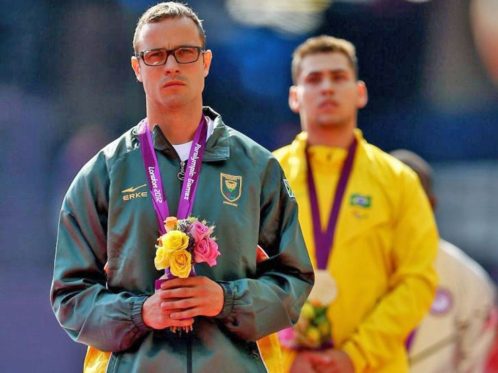 Oscar Pistorius (left) with his conqueror Oliveira at yesterday’s
medal ceremony