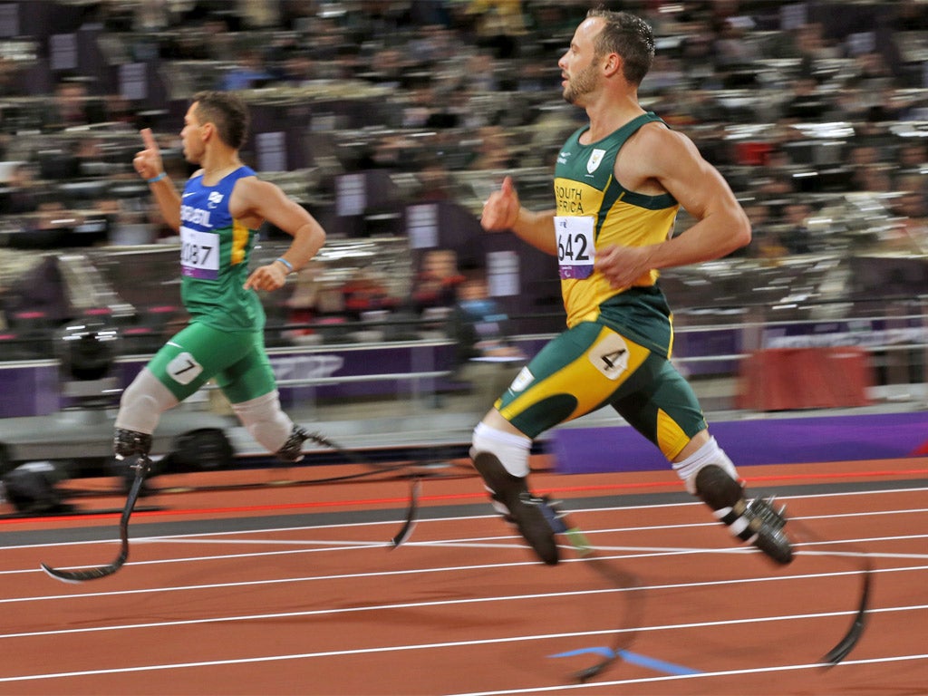 South Africa's Oscar Pistorius is beaten by Brazil's Alan Oliveira on Sunday