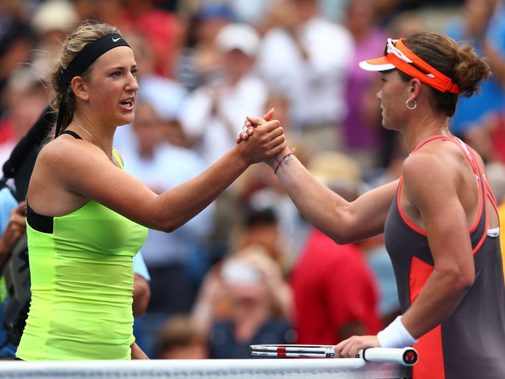 Victoria Azarenka of Belarus shakes hands with Samantha Stosur at the US Open