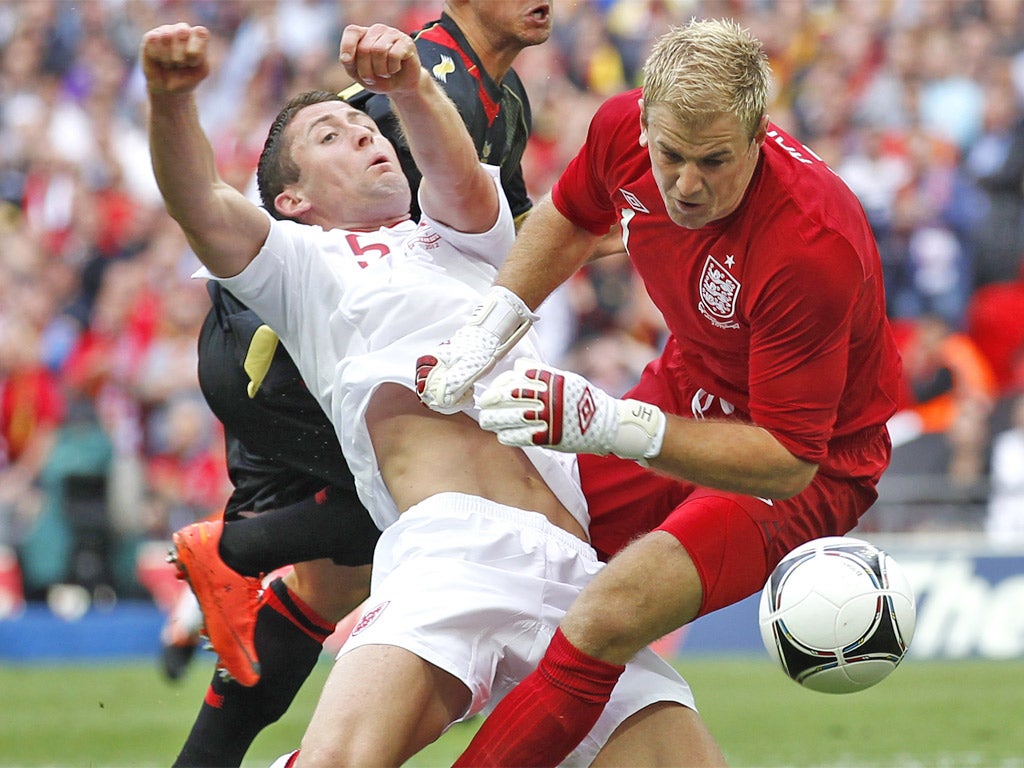 Gary Cahill breaks his jaw in a collision with Joe Hart in June