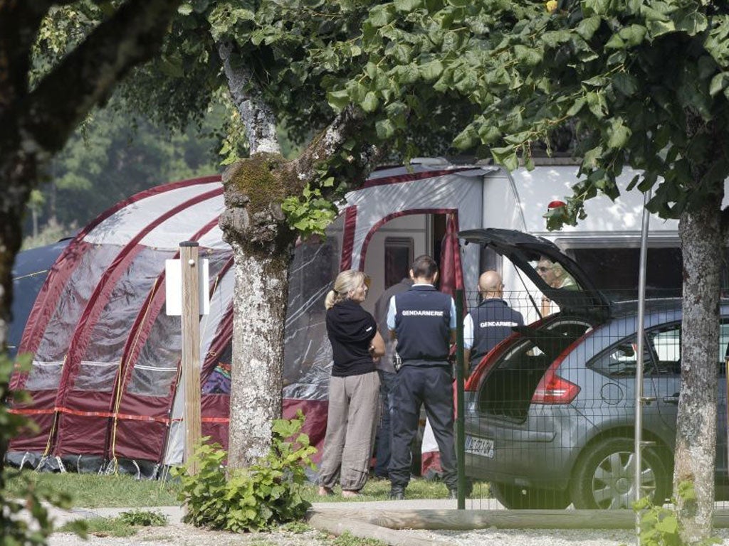 Investigators stand at the camp site where the  British family were holidaying