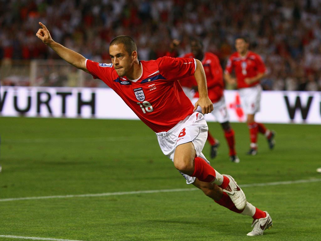 Joe Cole celebrates scoring for England