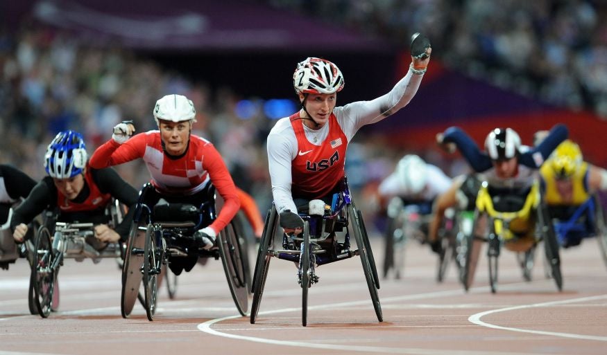 Tatyana McFadden crosses the finish line to claim her third gold of the Games