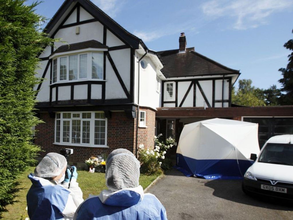 British forensic officers outside of the family's Claygate home