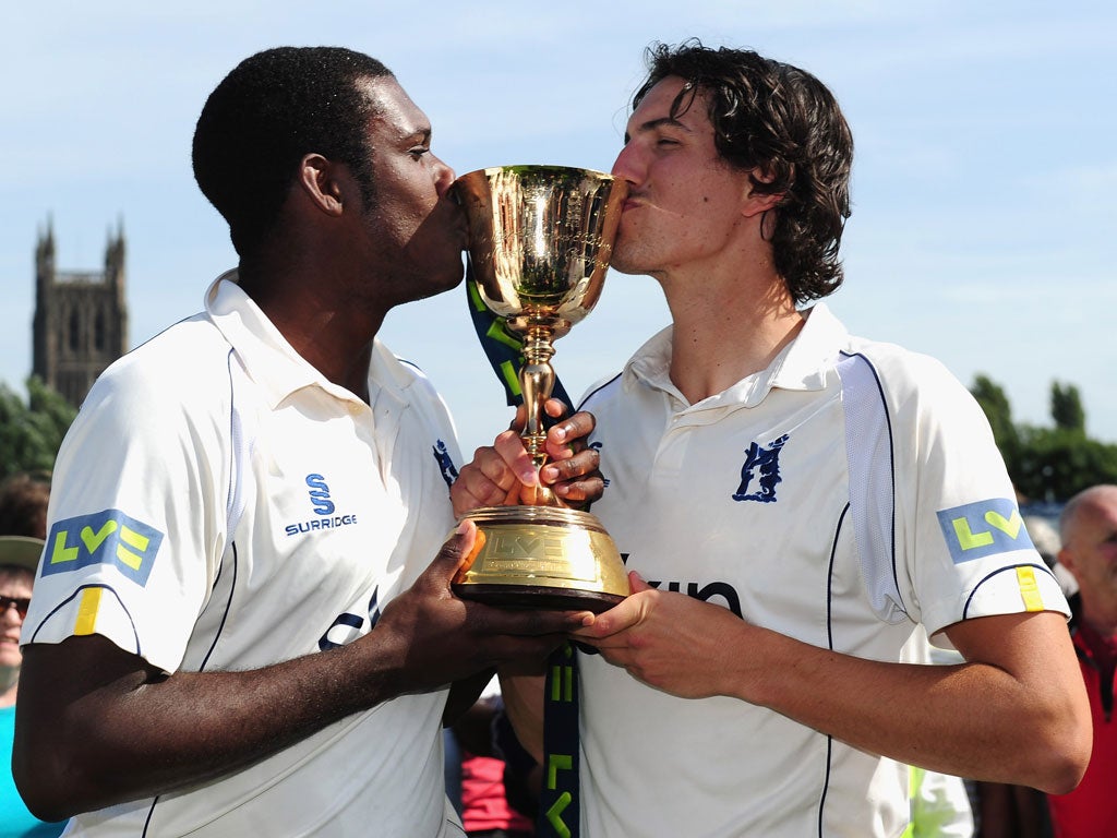 Swing the changes: Keith Barker (left) celebrates winning the Championship with fellow paceman Chris Wright