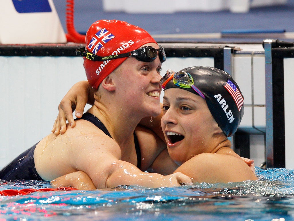 Winning smiles: Britain's Ellie Simmonds celebrates a silver in the S6 100m freestyle for her fourth medal of the London Paralympics alongside her American conqueror Victoria Arlen