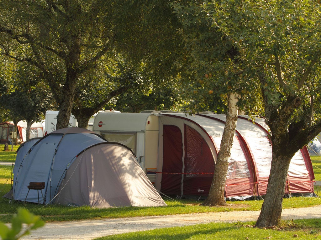 The caravan and tent used by the family in a Lake Annecy campsite