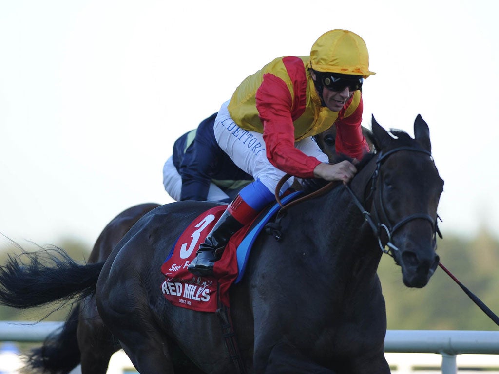 Frankie Dettori urges Snow Fairy to quicken to victory in the Irish Champion Stakes at Leopardstown