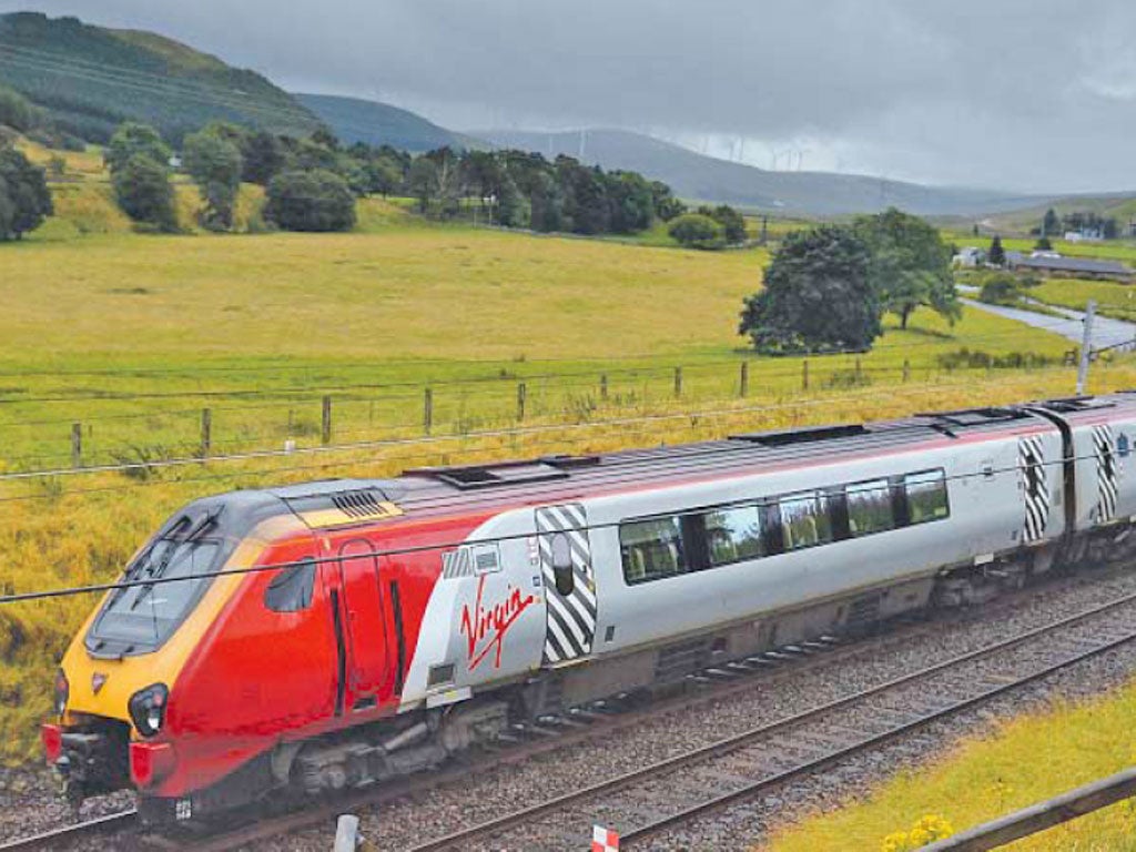 A Virgin train on the West Coast line in South Lanarkshire. Sir Richard and his company are being stripped of their franchise