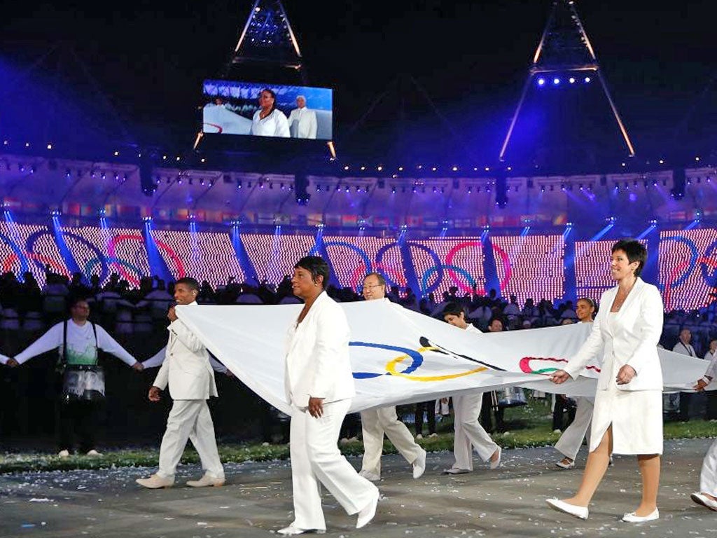 Doreen Lawrence holding the Olympics flag at the Opening Ceremony