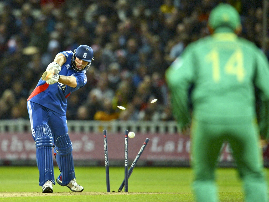 England's Michael Lumb is bowled for 5 runs