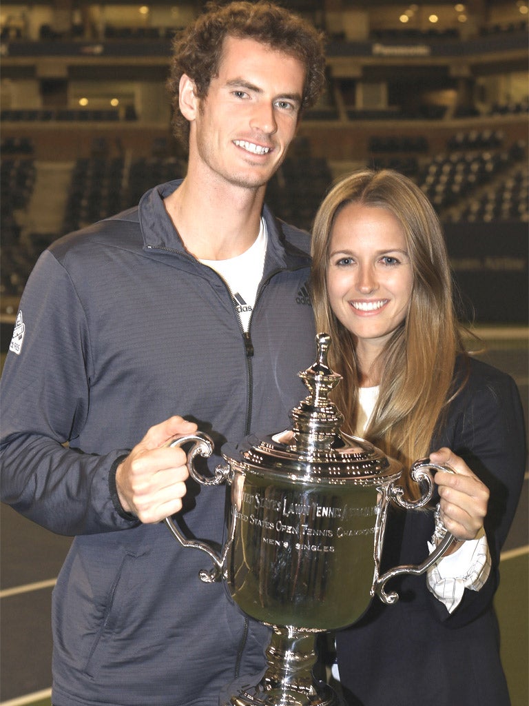 Andy Murray with his trophy and girlfriend Kim Sears