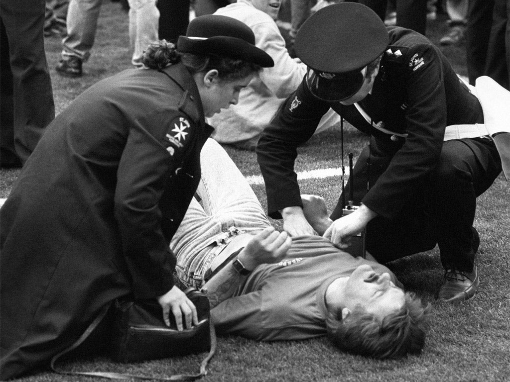 St John Ambulance members attend to one of the injured