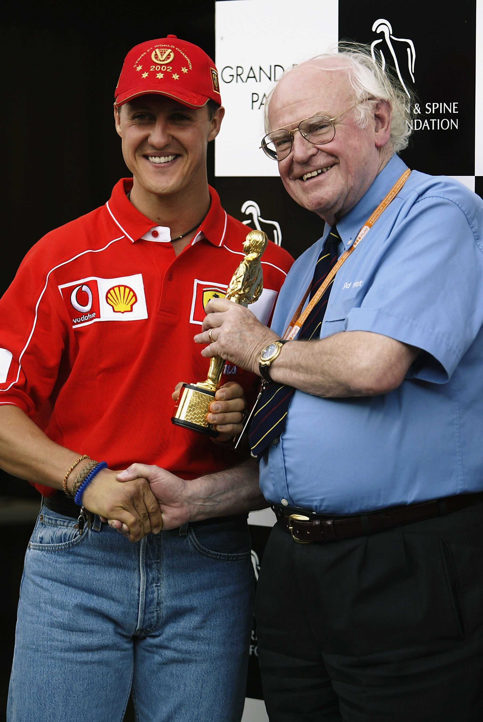 Sid Watkins (right) with former champion Michael Schumacher