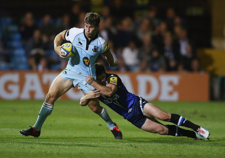 Dominic Waldouck of Northampton is tackled by Dan Hipkiss