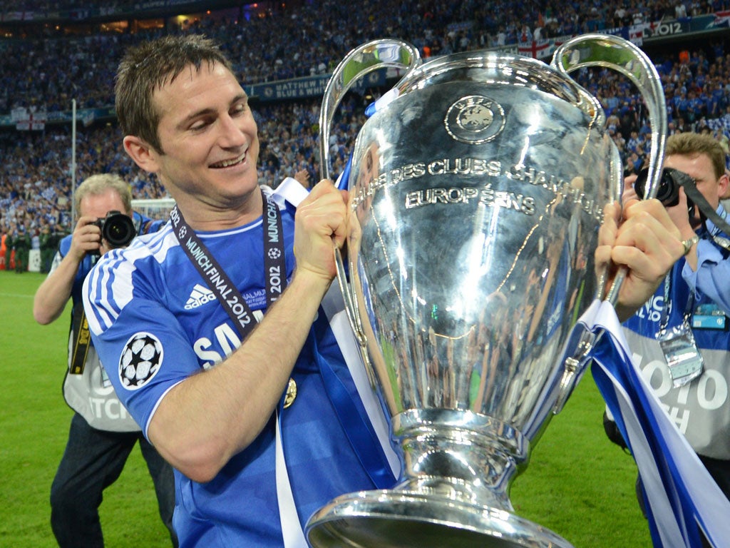 A giant step: Frank Lampard proudly holds the Champions' League trophy after last season's amazing victory