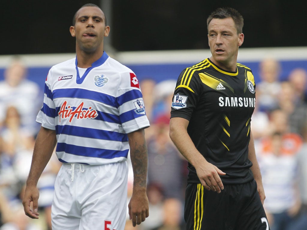 Angry young men: Anton Ferdinand and John Terry at Loftus Road
