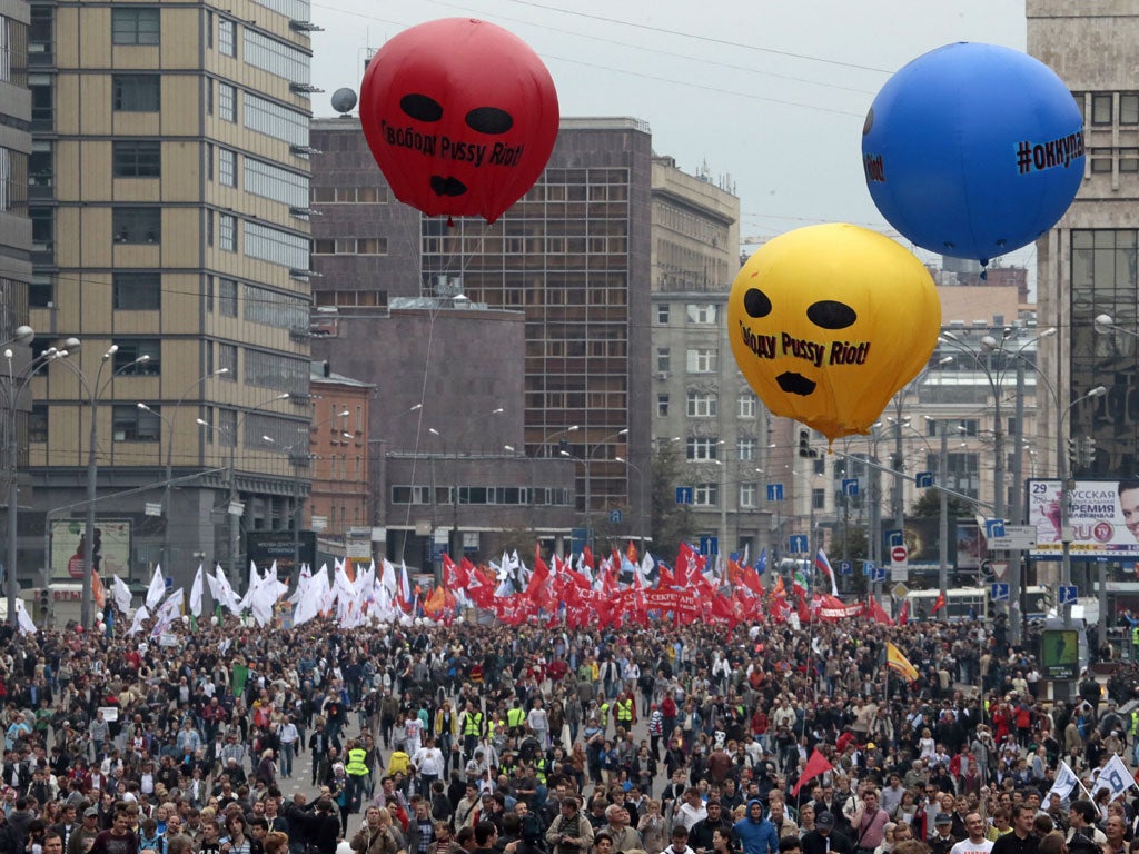 Marchers in Moscow yesterday: the balloons recall the Pussy Riot protest