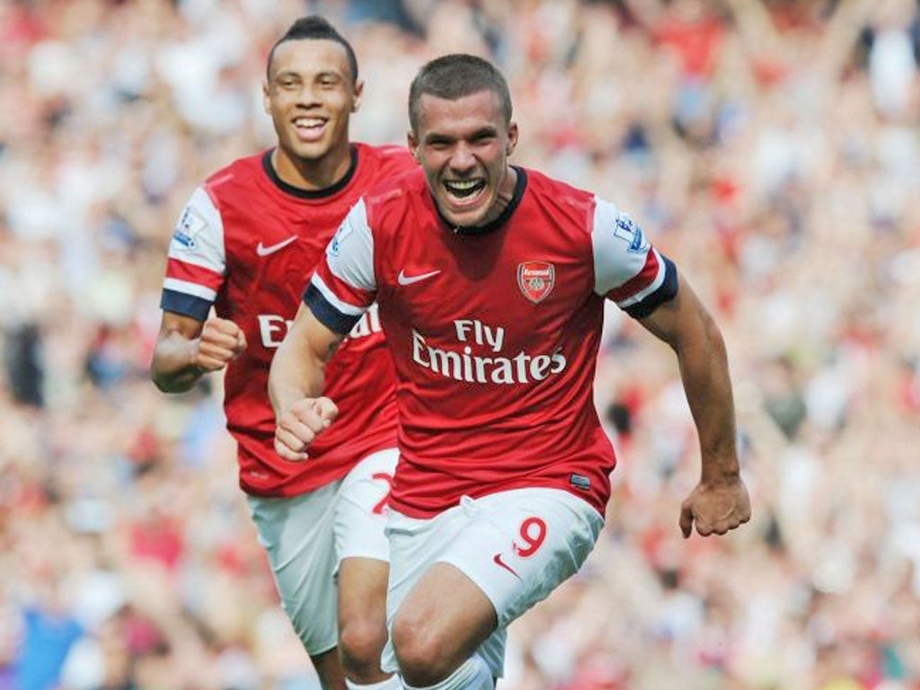 Lukas Podolski wheels away after scoring against Southampton