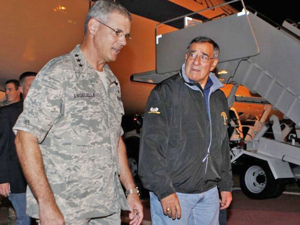 Leon Panetta, right, in Tokyo yesterday. His tour of the region will include China