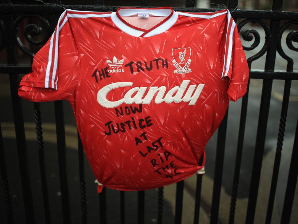 12 September 2012 A Liverpool shirt is tied to the gates at Anfield in tribute to the Hillsborough victims after the truth about the tragedy finally emerges.