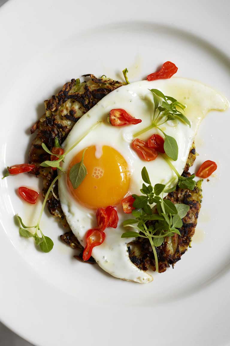 Courgette rosti with a fried duck's egg and chilli