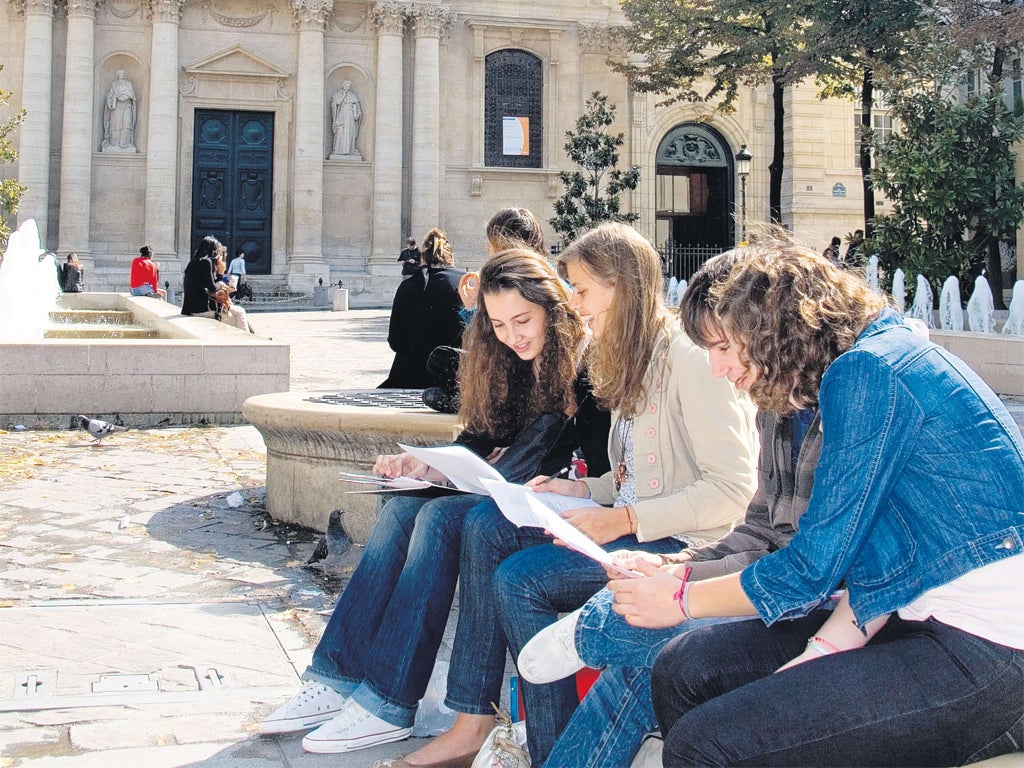 Students compare notes near Sorbonne University in Paris