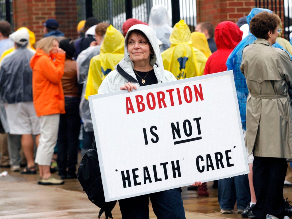 A woman protests against abortion.