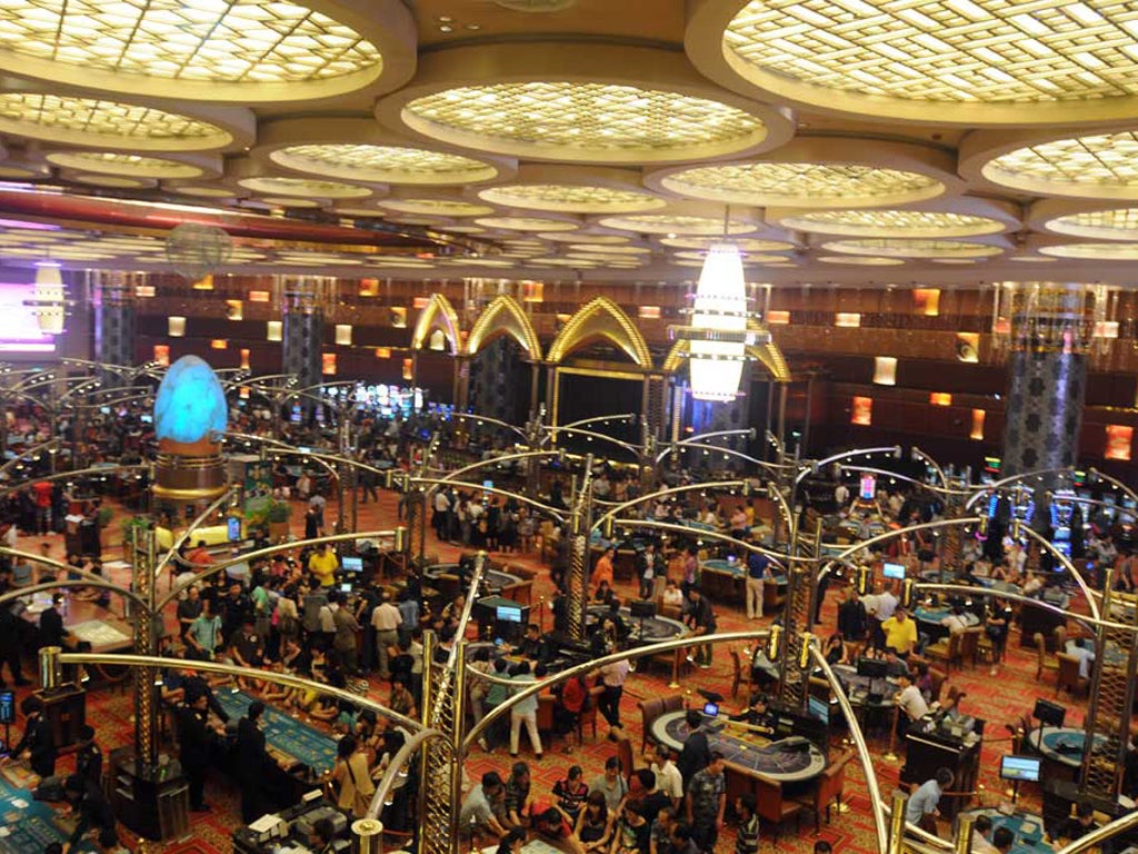 Baccarat tables dominate the Grand Lisboa casino. Macau, the only place in China where gambling in casinos is legal, dwarfs Las Vegas as the world's gaming capital