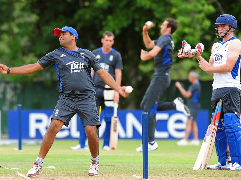 Samit Patel (left) turns his arm during training yesterday