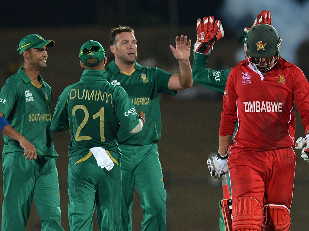 Jacques Kallis celebrates after he dismisses Zimbabwe cricketer Craig Ervine