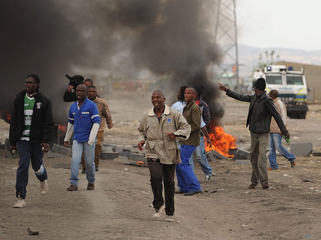 Miners pictured striking last week are back at work after reaching an agreement with the British owner - but there are fears that strikes could spread