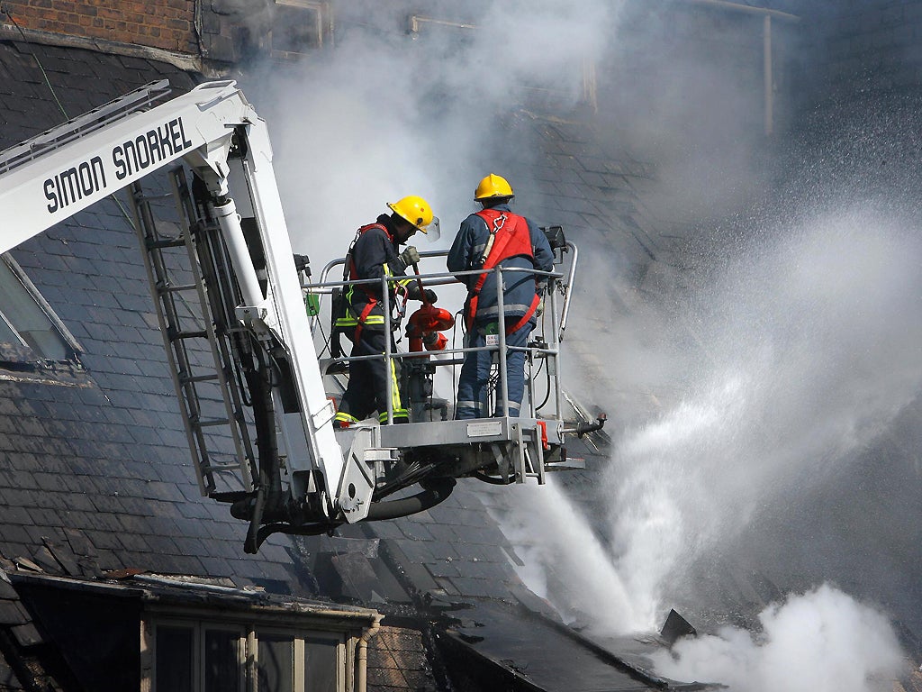 Firefighters in Manchester, where the chief fire officer warns that further cuts 'would significantly increase the total loss of domestic and commercial buildings'