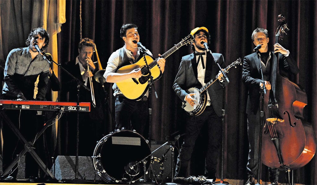 The high life: Ben Lovett, Marcus Mumford, Winston Marshall, and Ted Dwane of Mumford and Sons on stage during this year’s Grammy awards Awards in Los
Angeles