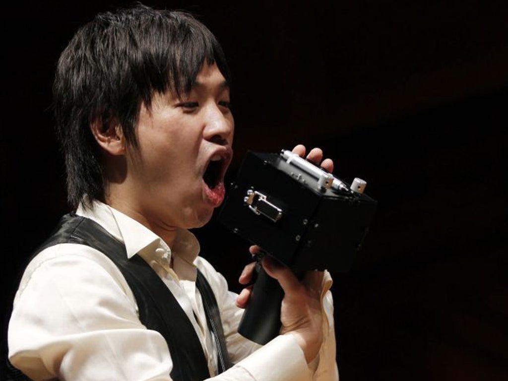 Koji Tsukada demonstrates the "Speech Jammer" after winning the 2012 Ig Nobel Acoustics Prize for creating the machine that disrupts a person's speech by making them hear their own words at a delay