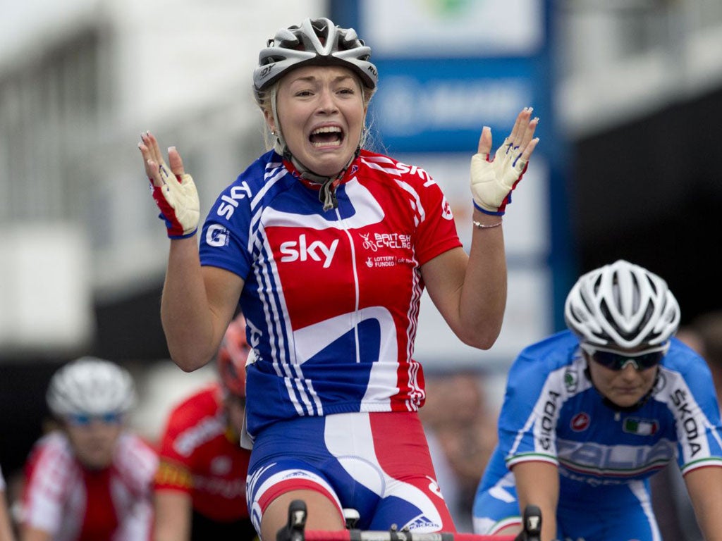 An emotional Lucy Garner crosses the finish line yesterday